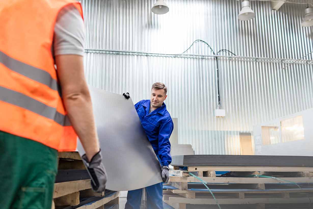 Men demonstrating some of our custom steel fabricating services in St. Clairsville, OH