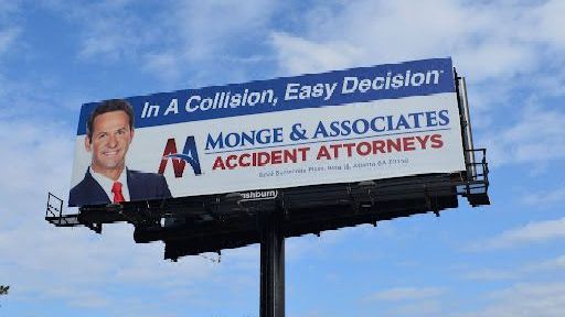 a billboard for monge & associates accident attorneys