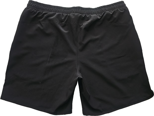 Black athletic shorts with zippered pockets and logo.
