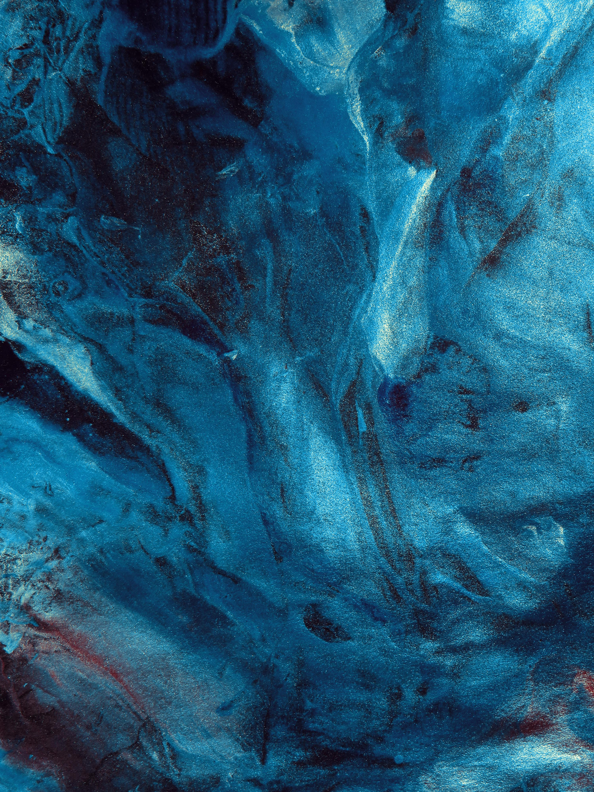 Abstract blue textured pattern with swirling light and dark aqua strokes