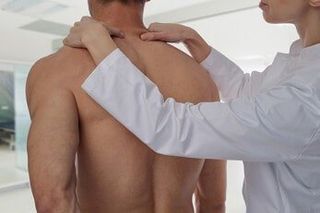 Acupressure, Man having chiropractic back adjustment — Chiropractic in Los Angeles, CA