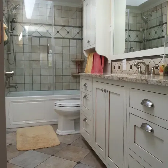 A bathroom with a toilet a sink and a bathtub