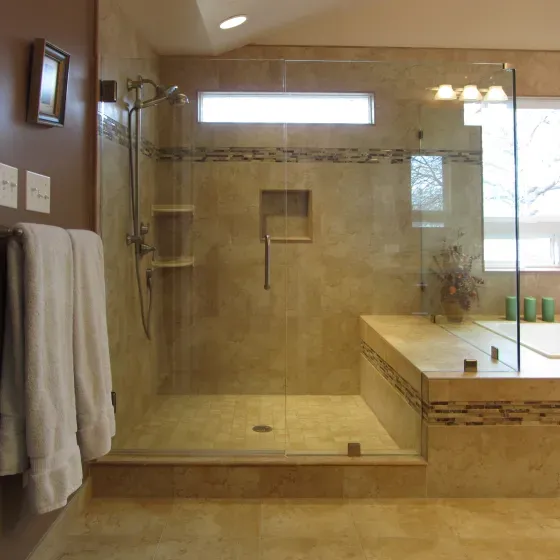 A bathroom with a walk in shower and a bathtub