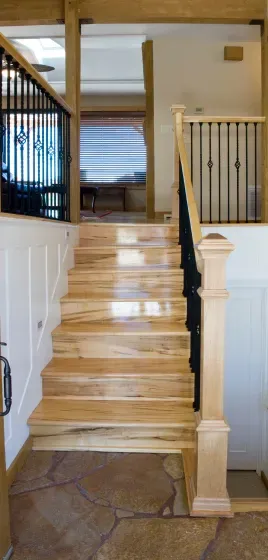 A wooden staircase leading up to the second floor of a house.