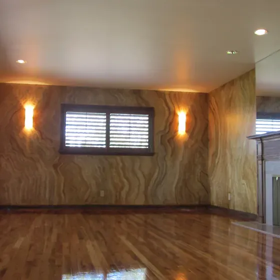 A living room with hardwood floors and a window