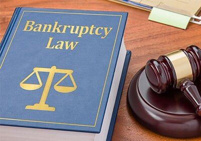 Law book with a gavel — Bankruptcy attorney in Albany, GA
