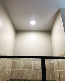Electrician installed recessed light in shower