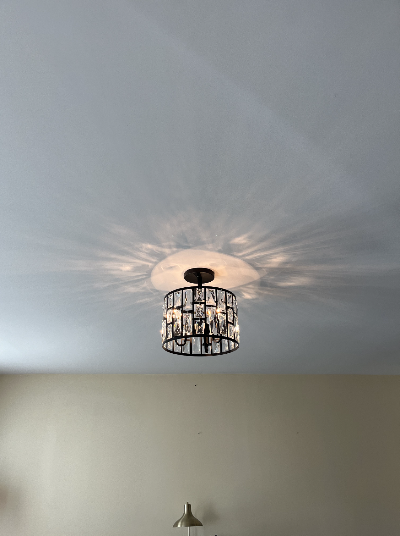 Ceiling light installation showcasing modern and stylish lighting fixture in a well-lit room, professionally installed by Harris Electrical Contractors in Cary, NC