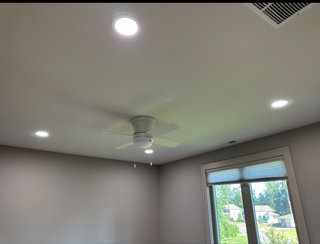 Ceiling with recessed lights evenly spaced for ambient illumination