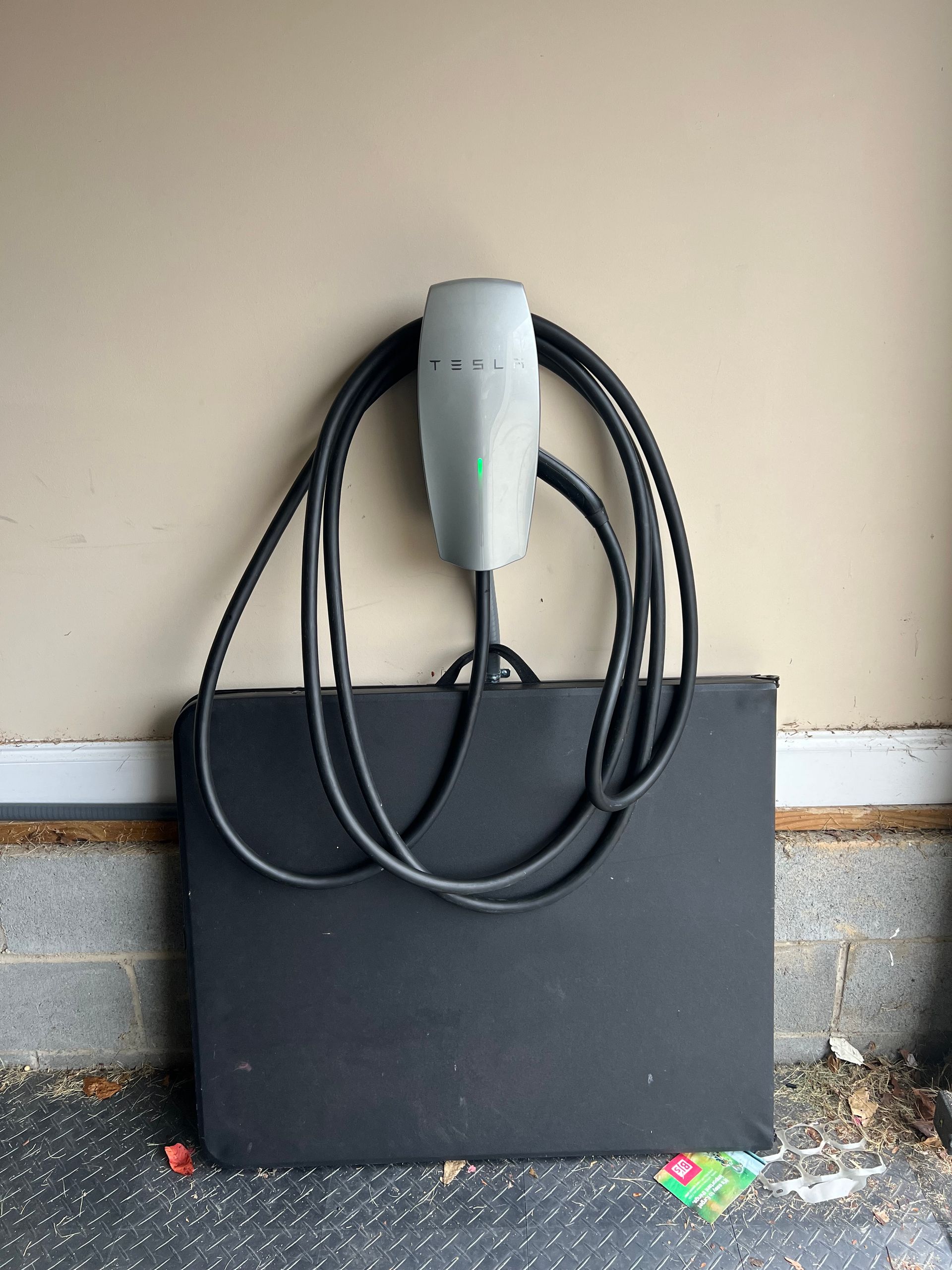 Tesla home charging station in a residential garage