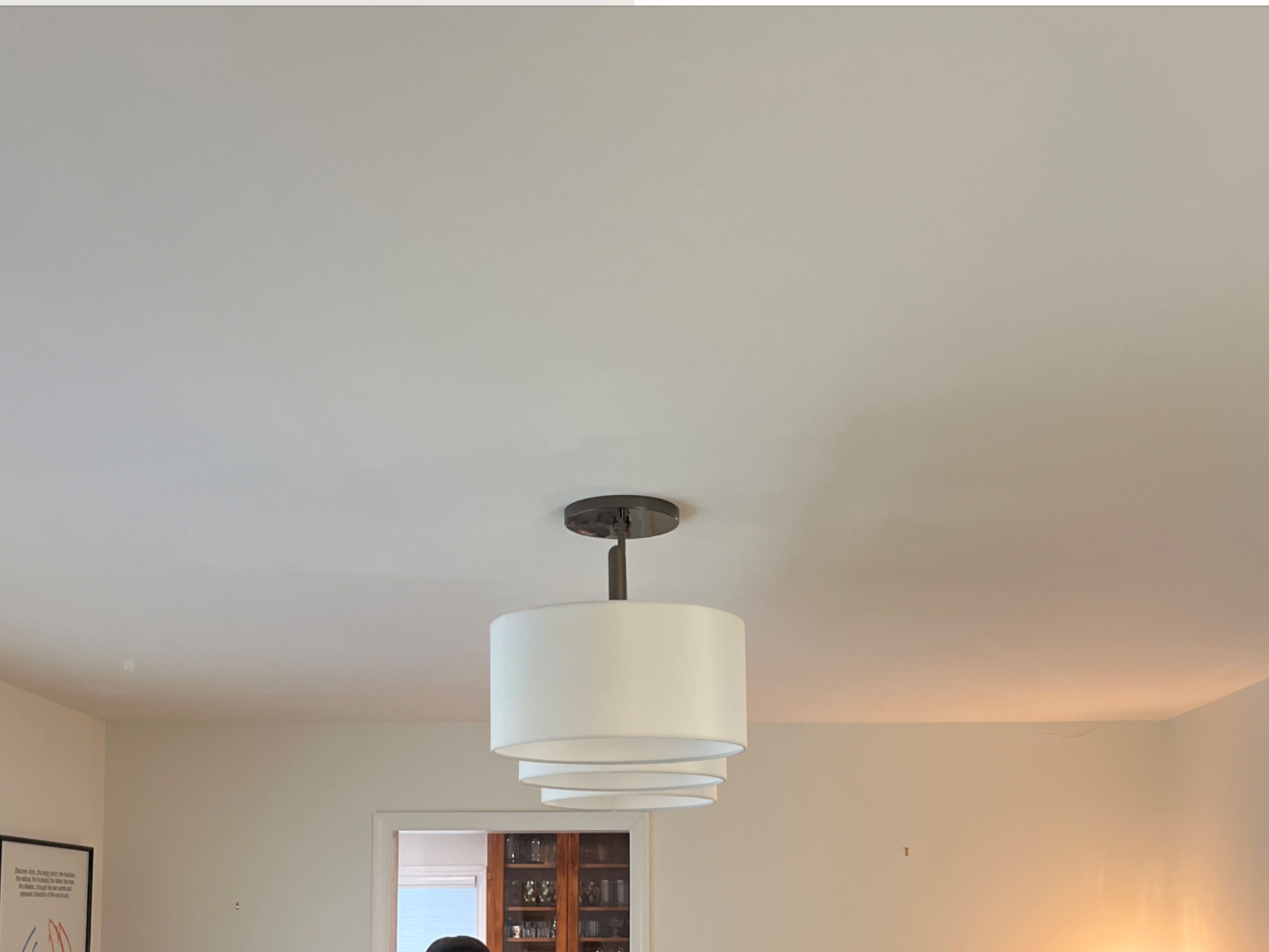 Ceiling light fixture newly installed in a modern living room