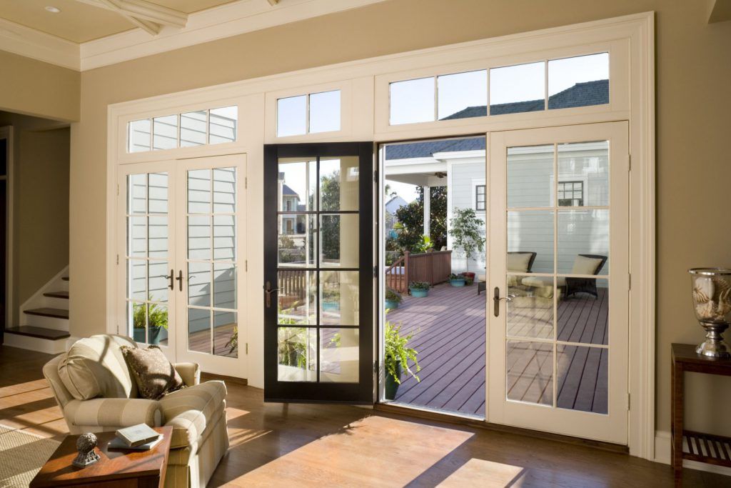 A living room with sliding glass doors leading to a deck