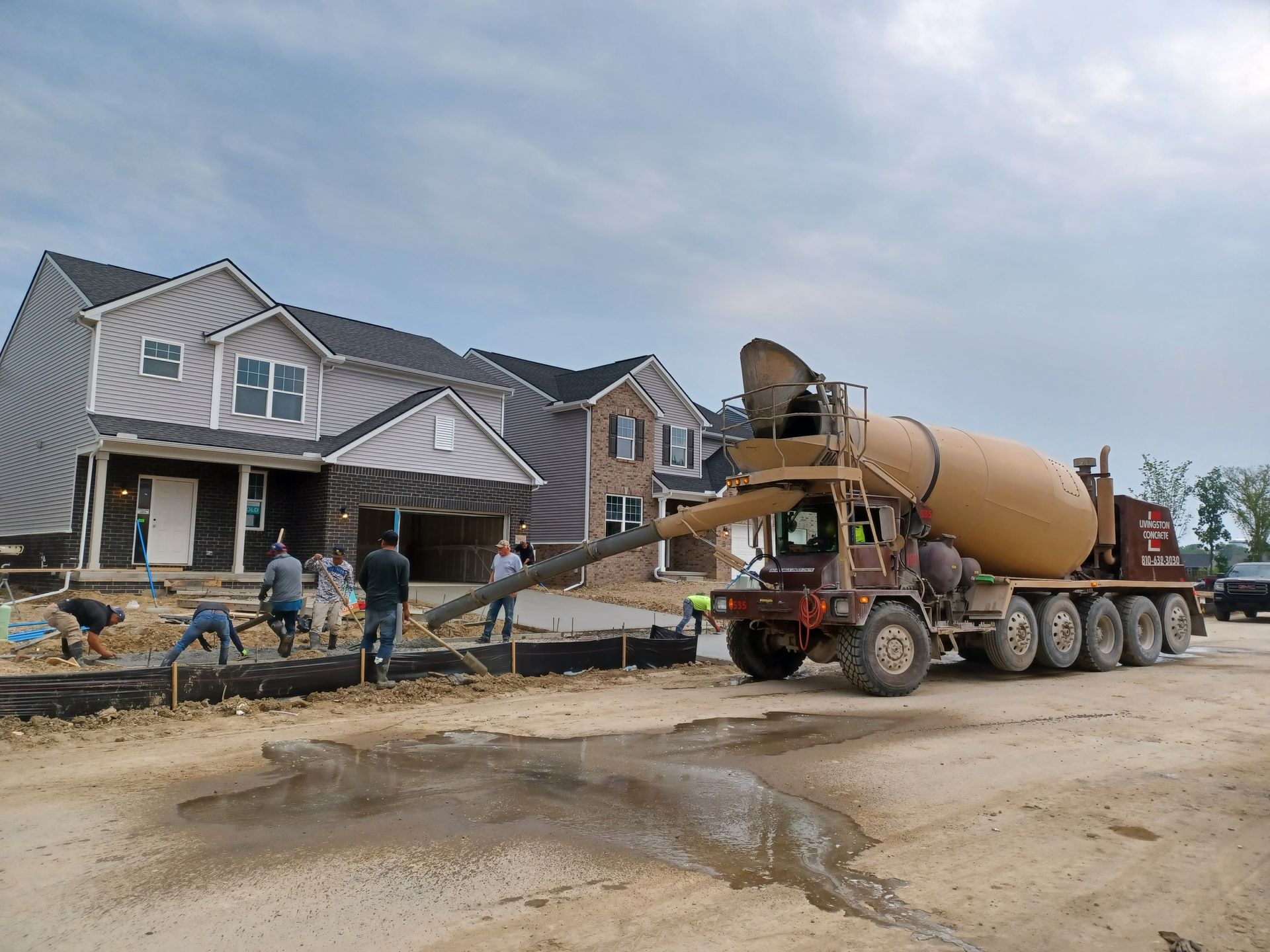 A large house with a square driveway in front of it