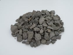 A pile of rocks is sitting on top of a white surface.