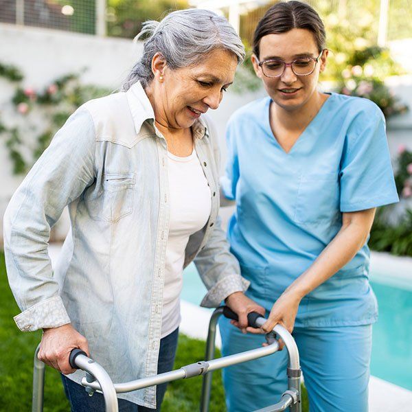 Nurse Supporting Old Woman to Walk | New York, NY | Coney Island Home Care