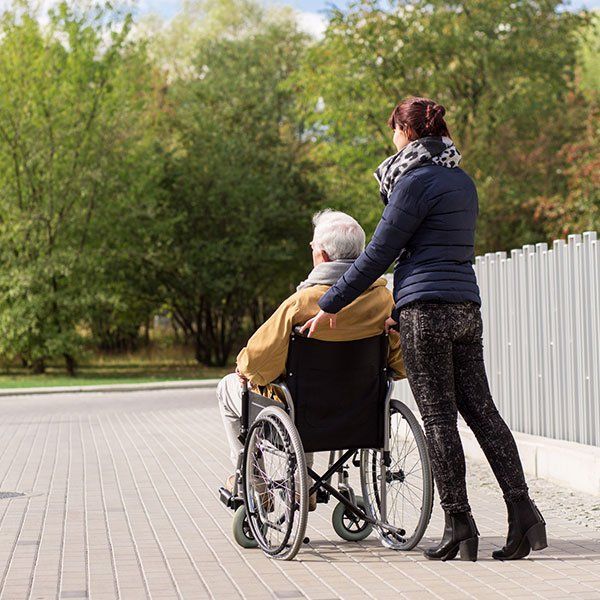 Man on Wheelchair with Nurse | New York, NY | Coney Island Home Care