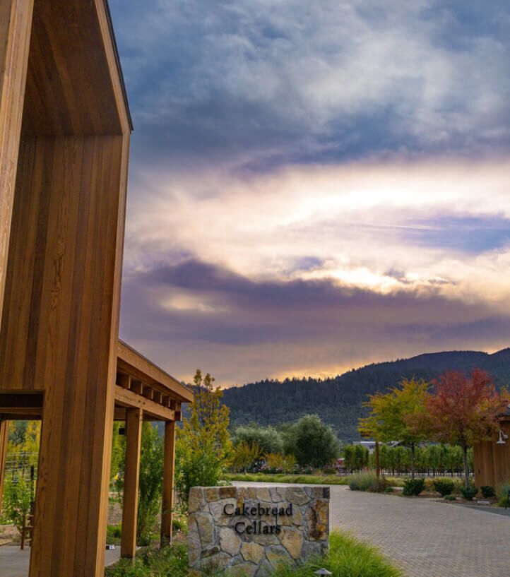 A sign in front of a building at a winery.