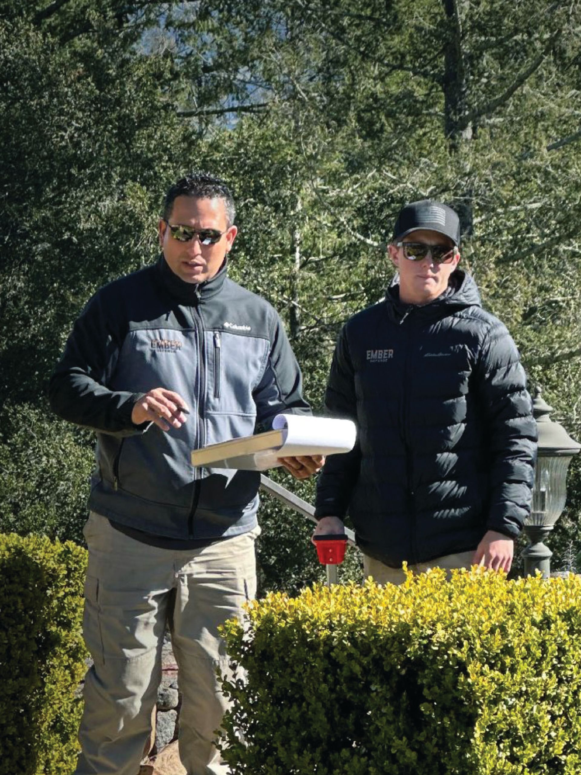 Two men are completing a property evaluation.