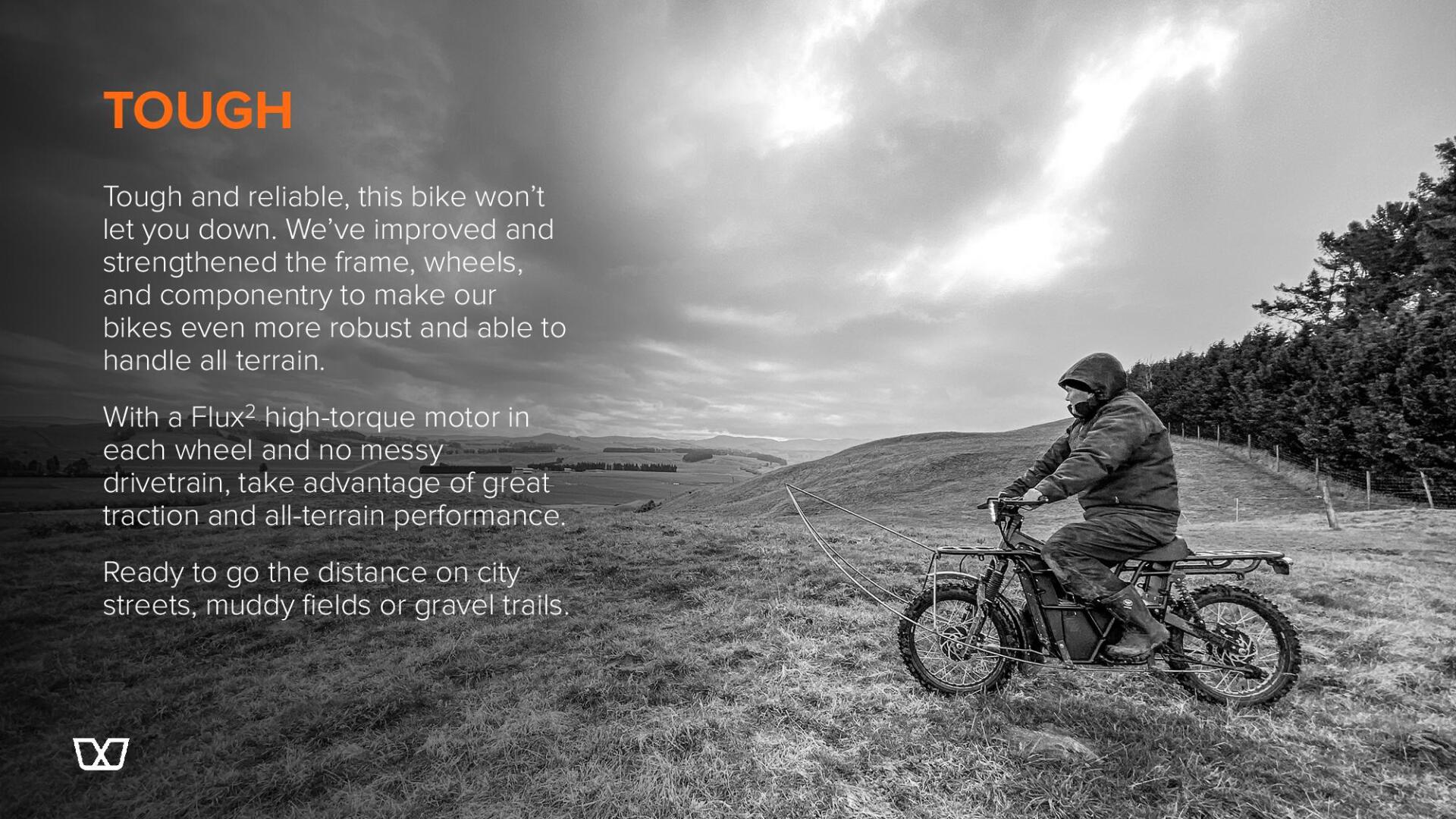 A man is riding a dirt bike on a dirt road.