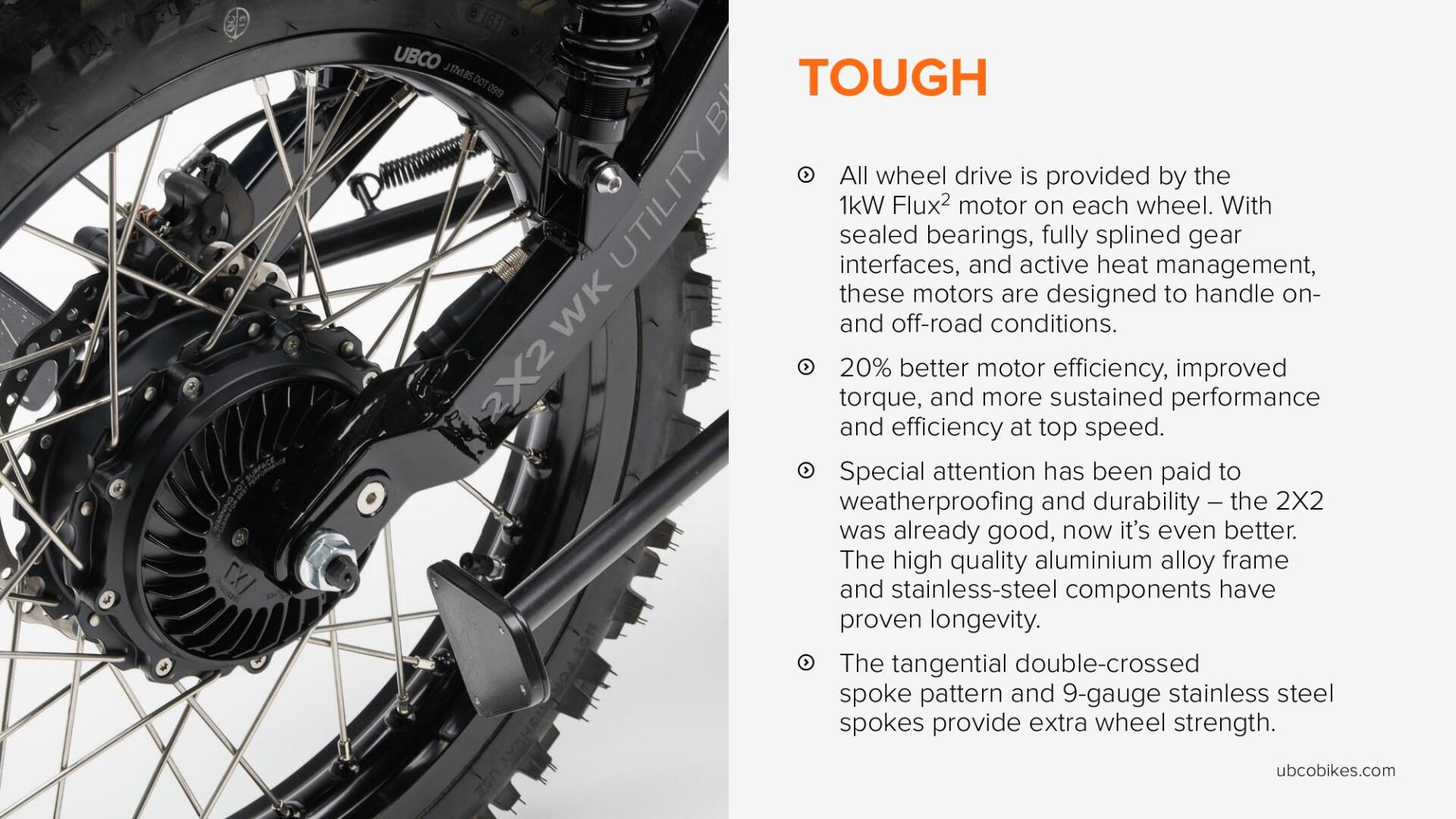 A close up of a motorcycle wheel with the word tough on it.