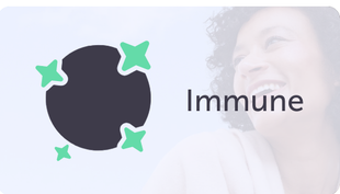 A woman is smiling in front of a sign that says immune