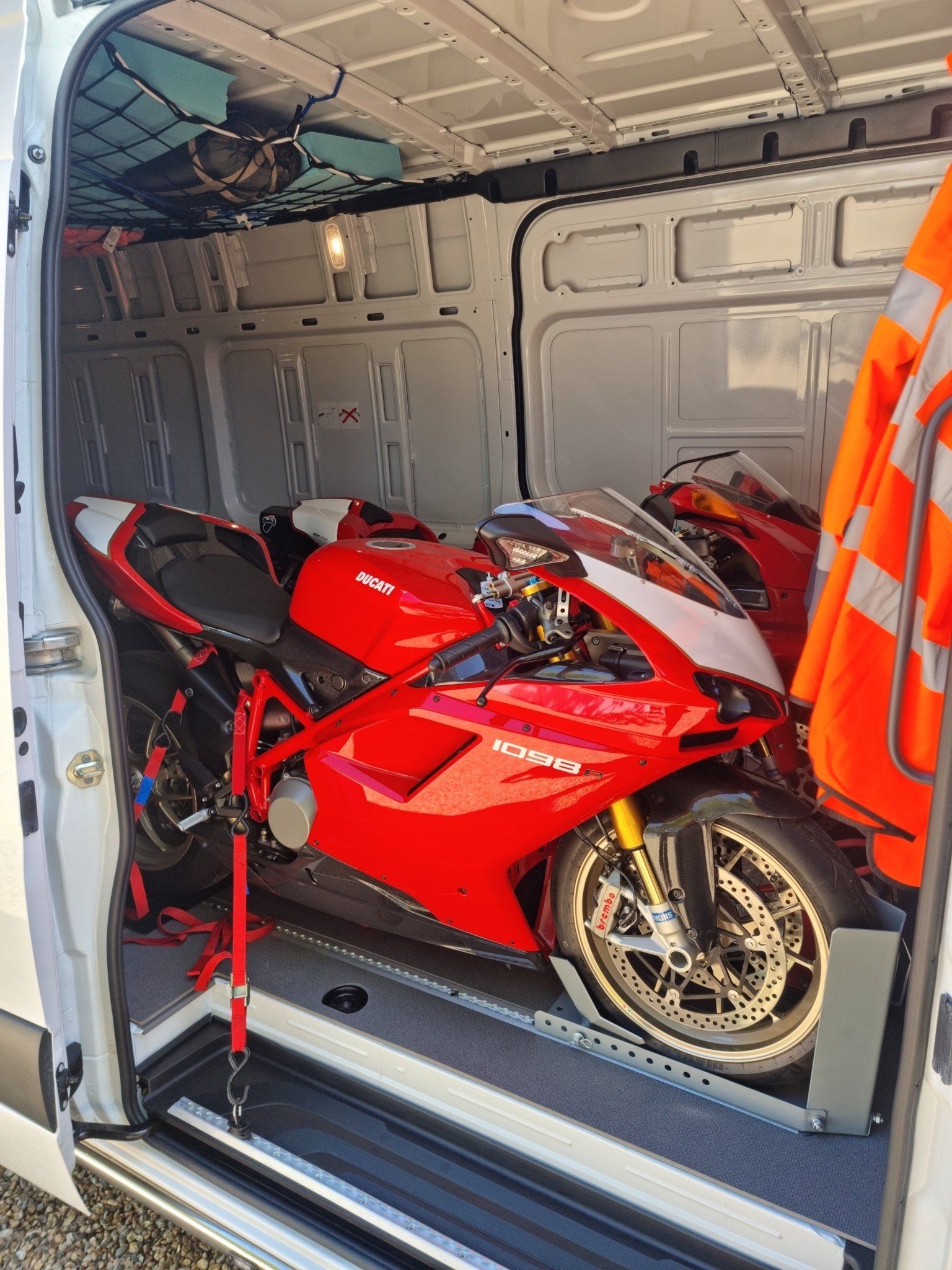 A pair of Ducatis secured in a Mercedes Sprinter for transport by MTC Transport