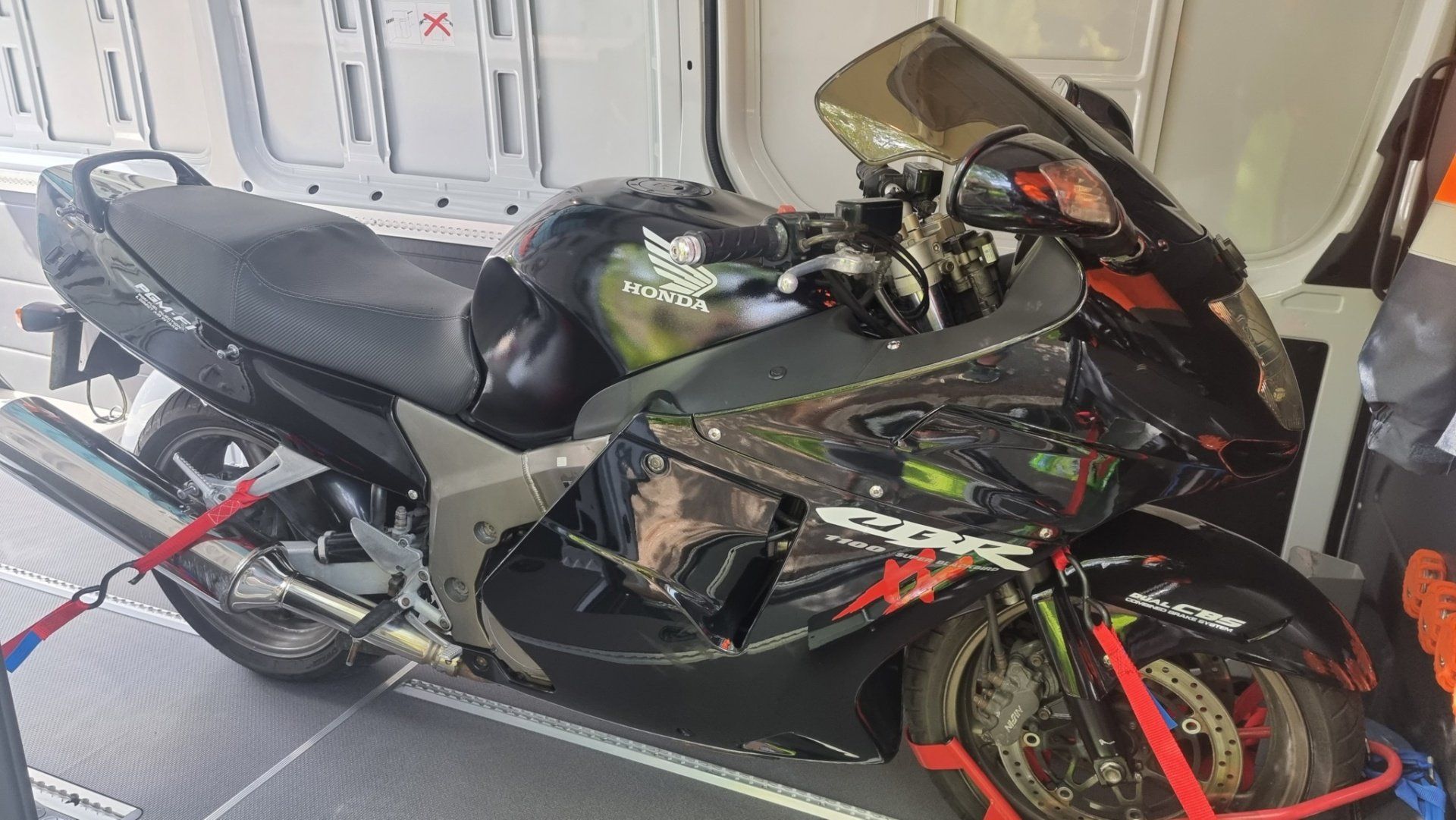 A Honda CBR1100 Super Blackbird secured in a Mercedes Sprinter for transport by MTC Transport