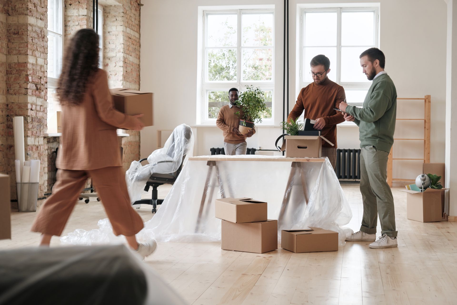 A group of people are moving into a new apartment.