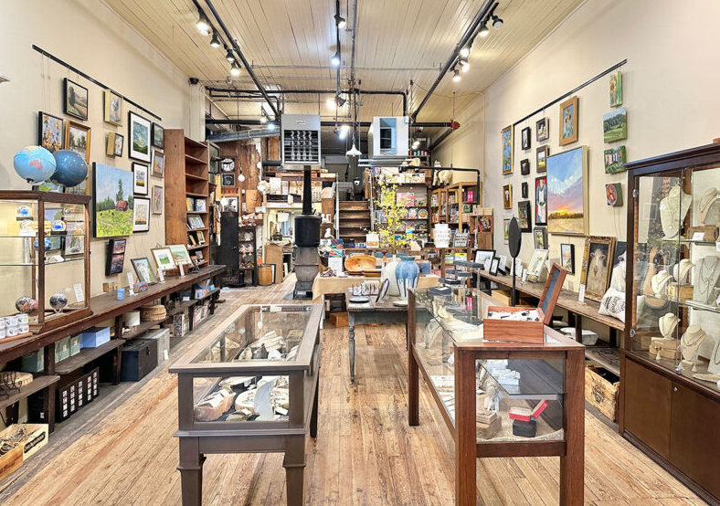 A store filled with lots of tables and display cases.