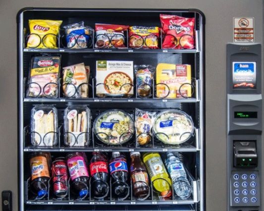 A vending machine filled with lots of snacks and drinks