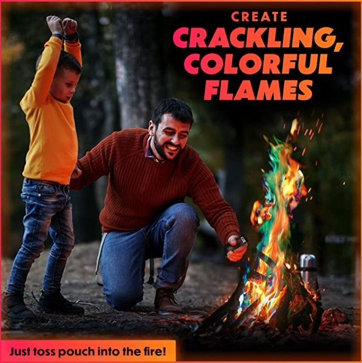 A man and a boy are playing with a fire that says create crackling colorful flames