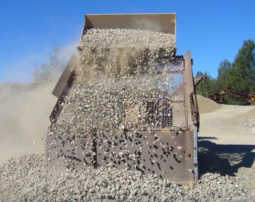Piles of Dark Grey Rocks, Possibly Rubble — Coastal Sand Soil & Mulch in River Heads, QLD