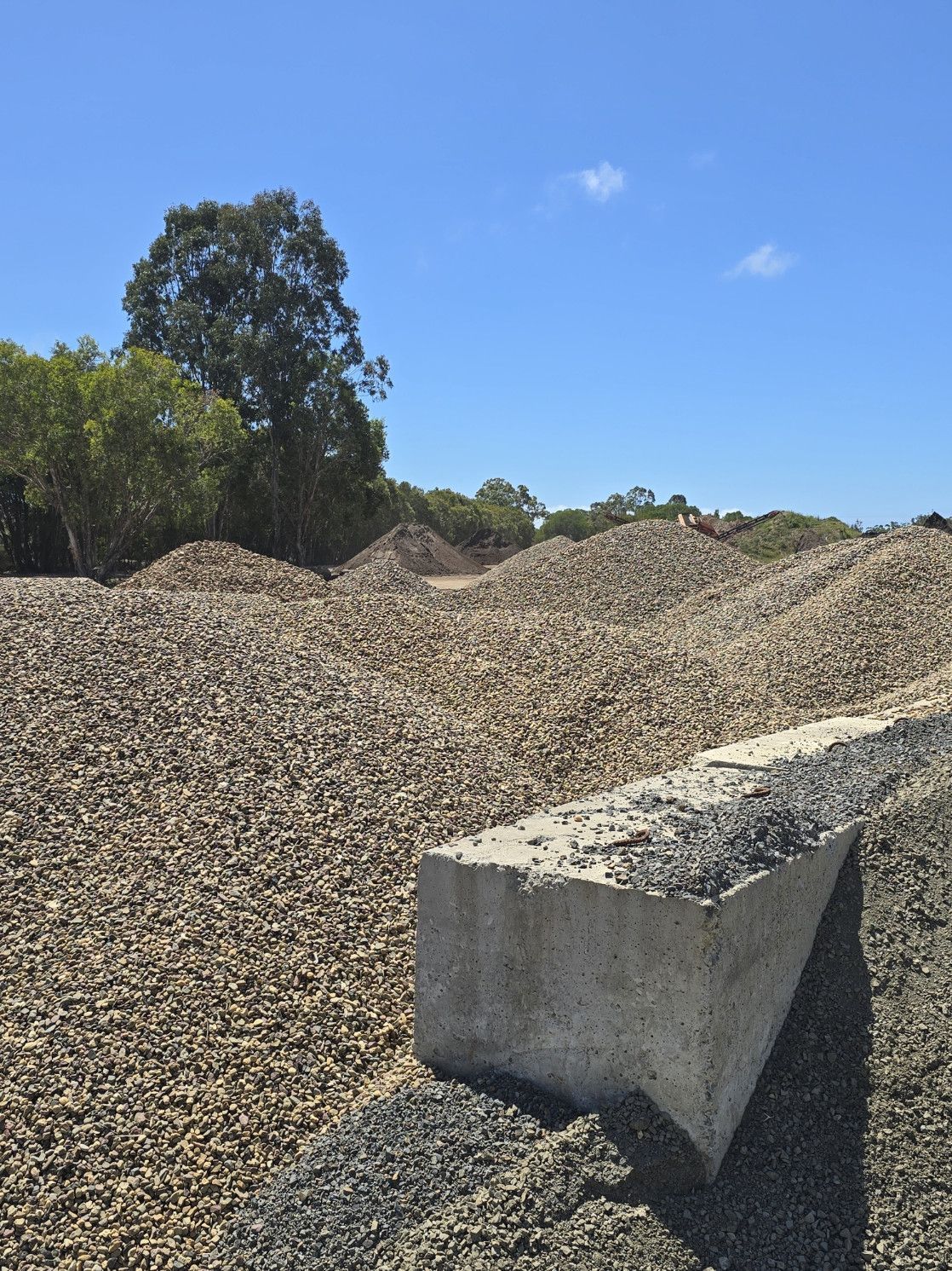 Close-up of Small, Tan Gravel Stones Covering a Surface — Coastal Sand Soil & Mulch in Fraser Coast, QLD