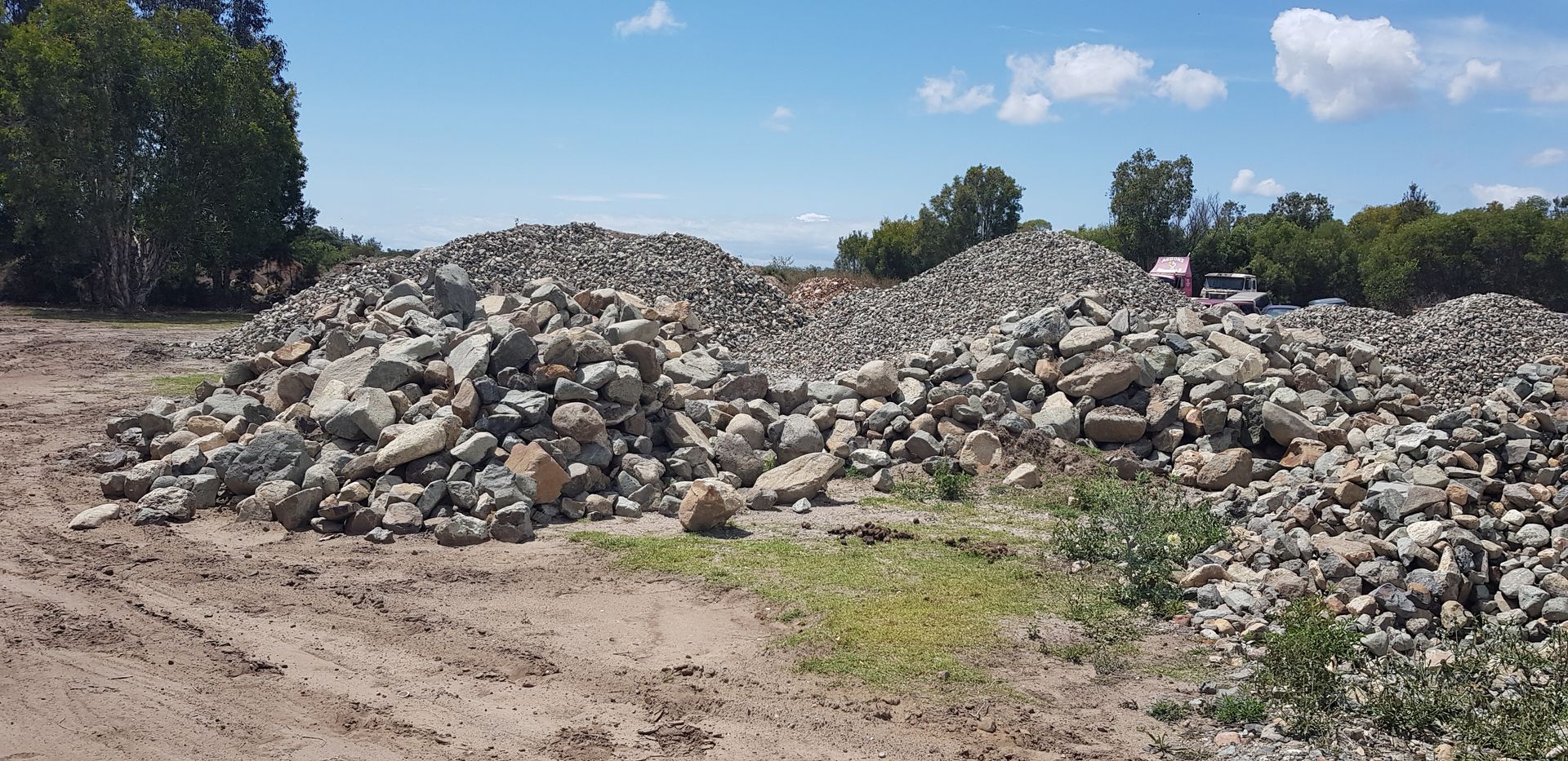 Stone and Wood Chip Landscaping with White and Brown Materials — Coastal Sand Soil & Mulch in Point Vernon, QLD