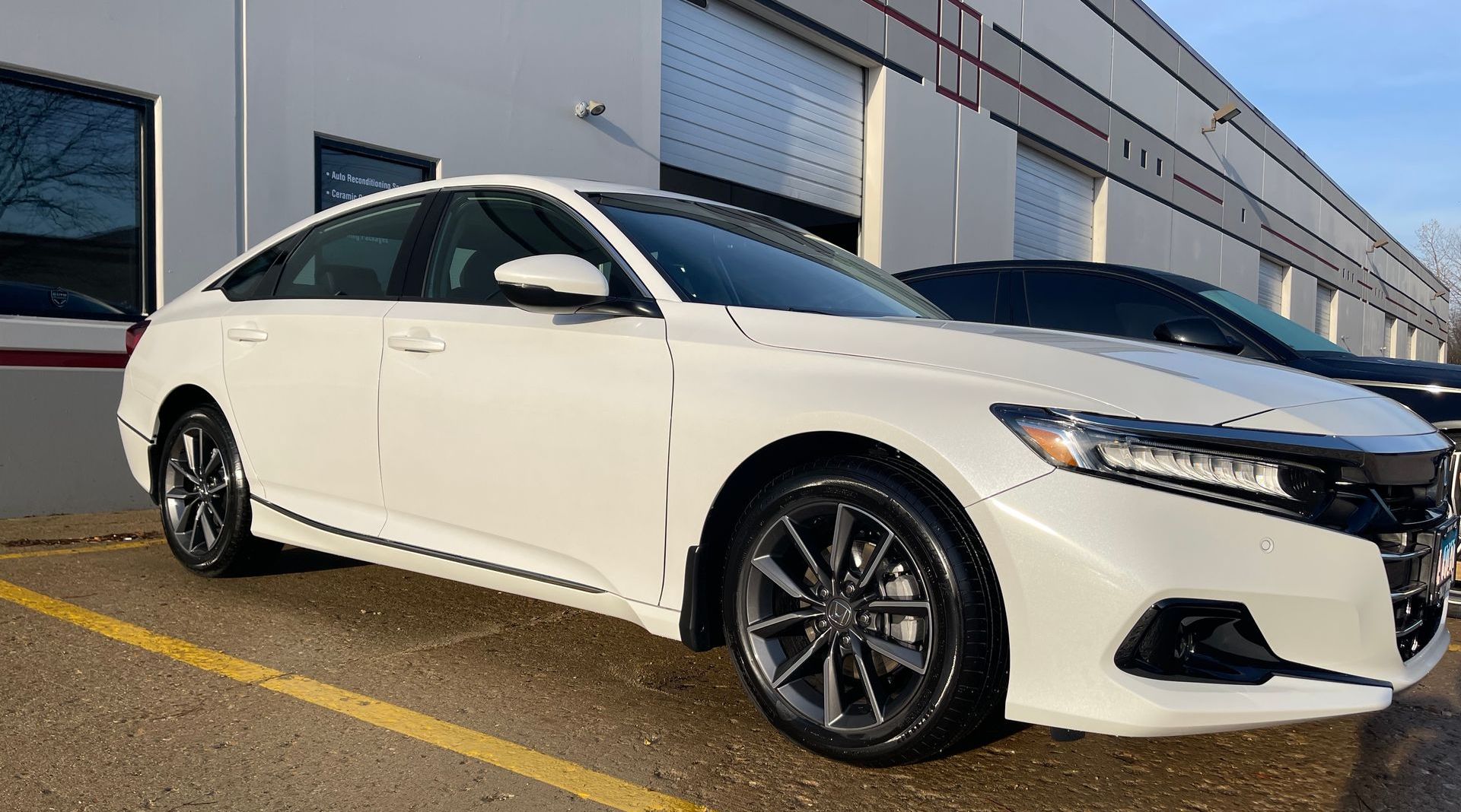 a white car being parked outside