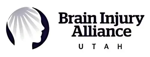 Logo for the Brain Injury Alliance of Utah featuring a stylized silhouette of a human head in a dark circle.