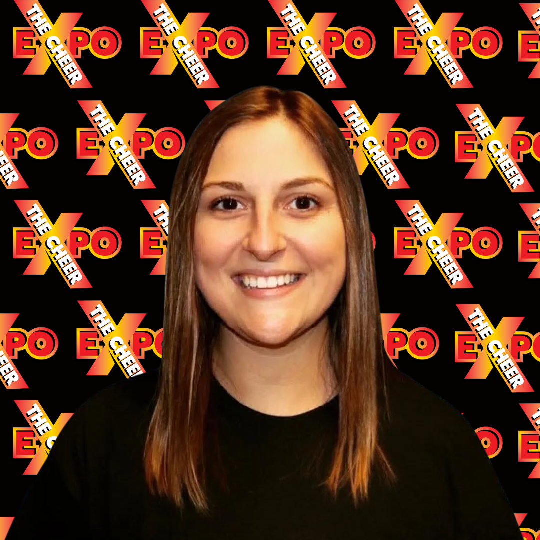 A woman is smiling in front of a black background with the word expo on it.