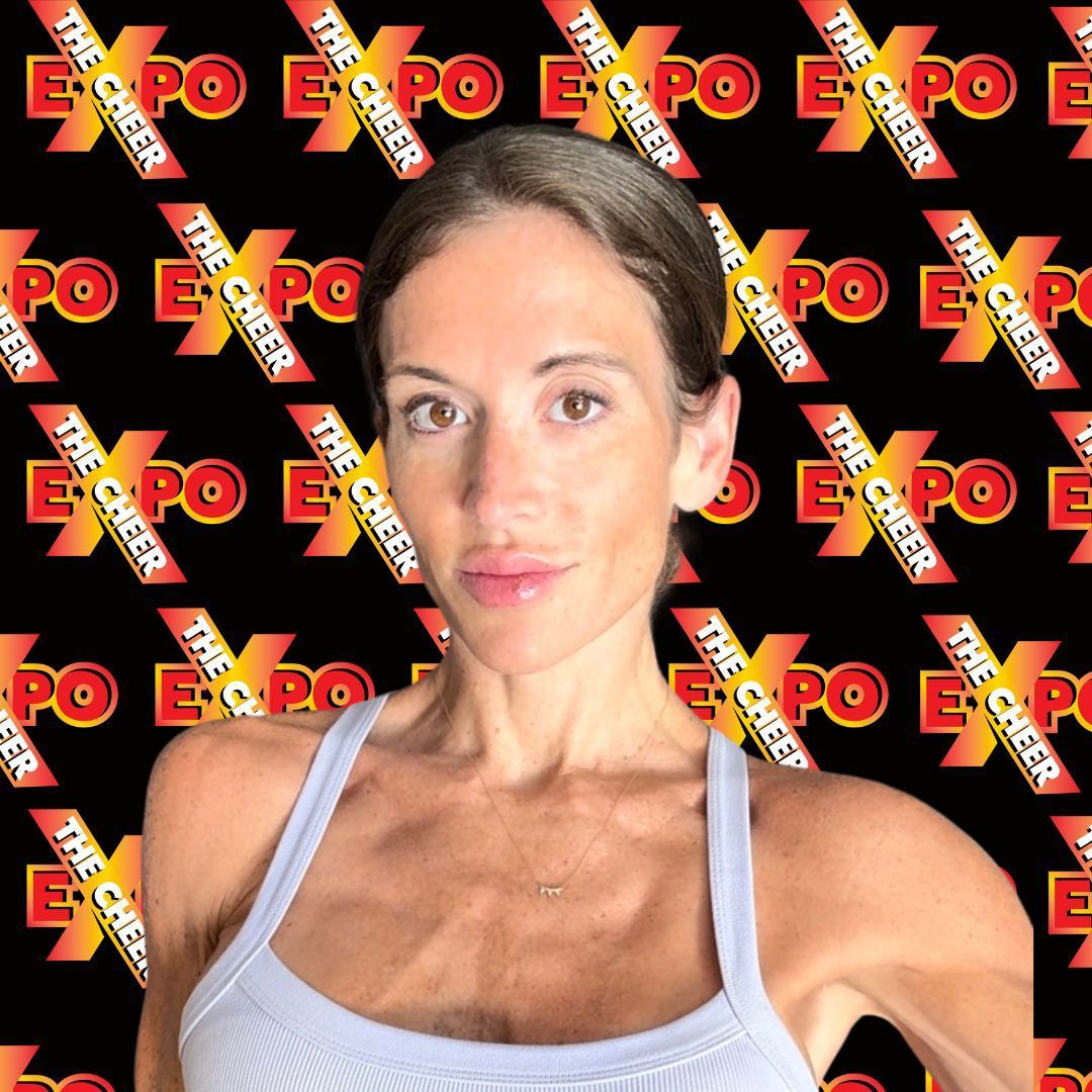 A woman is standing in front of a black background with the word expo on it