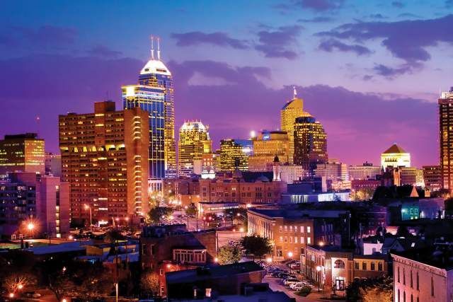 An aerial view of a city skyline at night