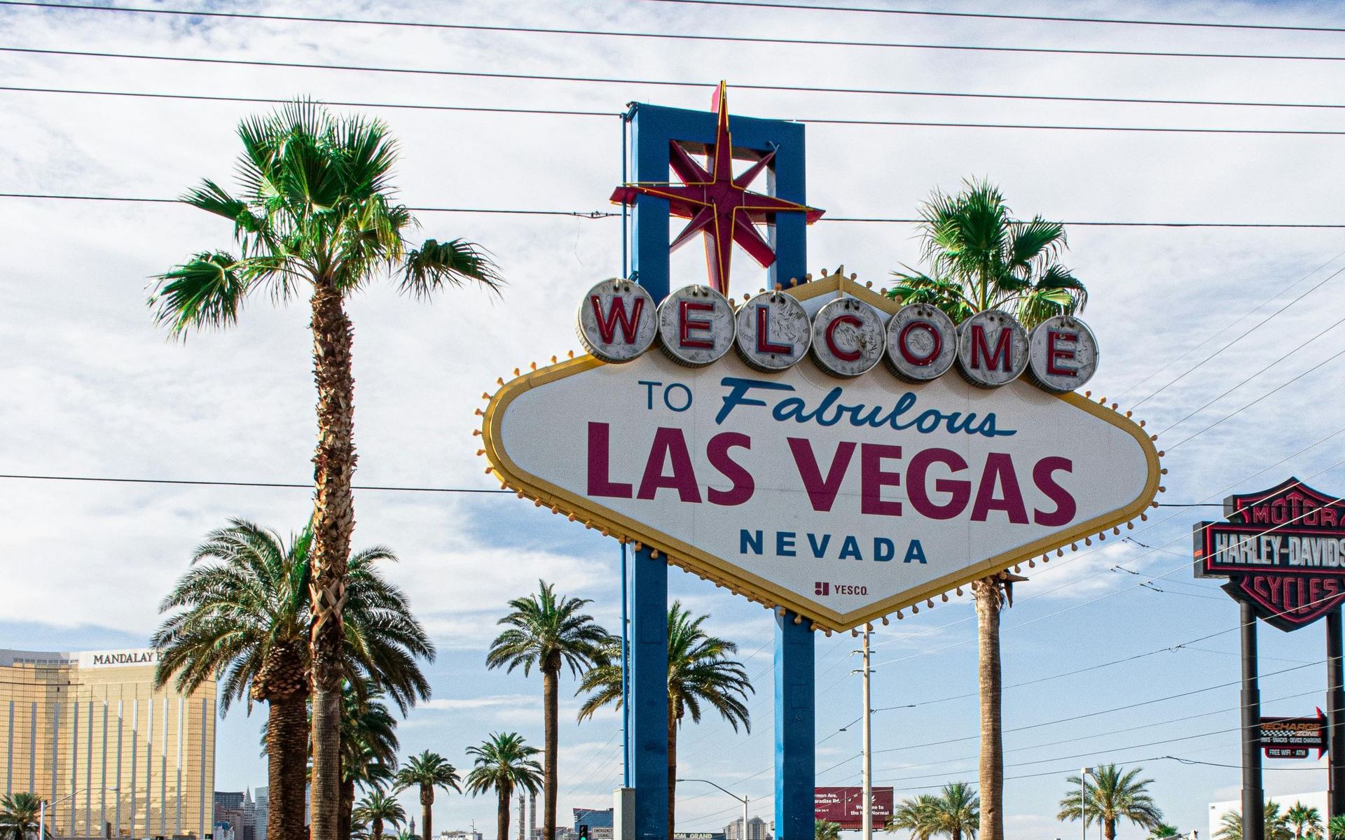 A welcome to fabulous las vegas sign with palm trees in the background