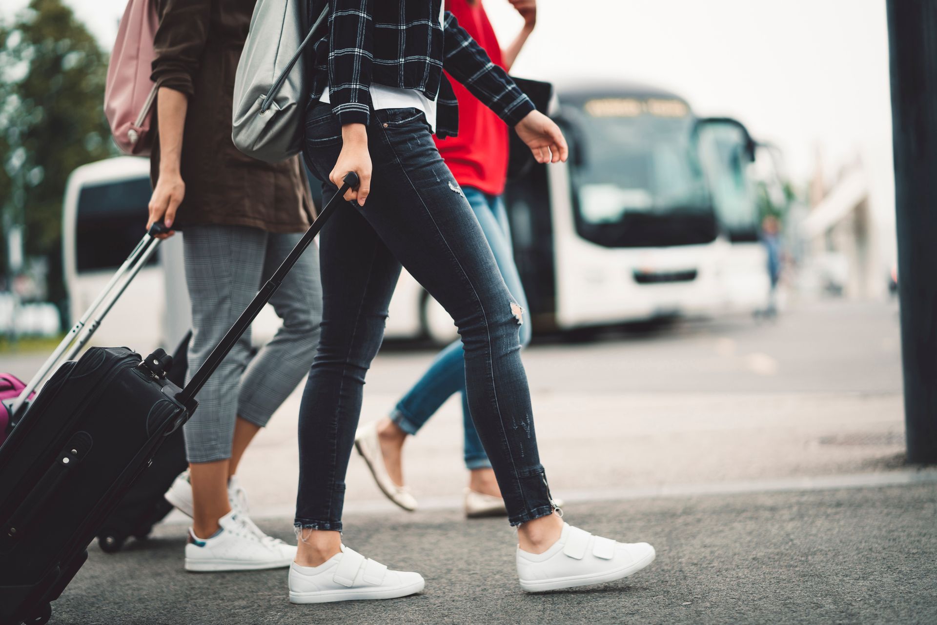 A group of friends heading to the airport is planning travel during the bathroom remodel A group of friends heading to the airport is planning travel during the bathroom remodel