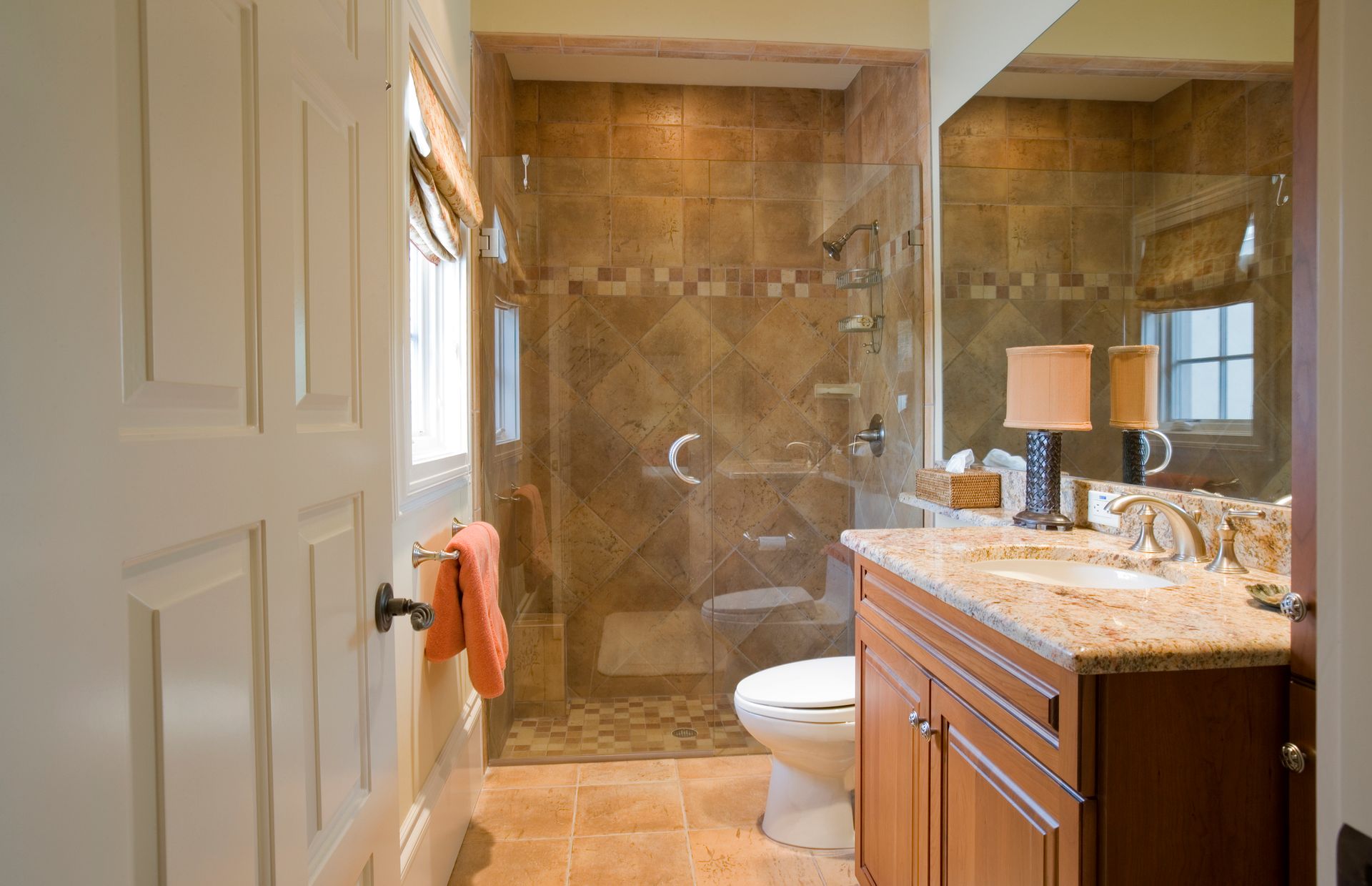 Beautiful guest bathroom with granite counter tops and marble floors. Beautiful guest bathroom with granite counter tops and marble floors.