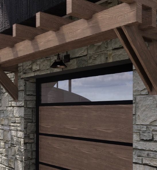 Wooden garage door with window, stone facade, and wood pergola.