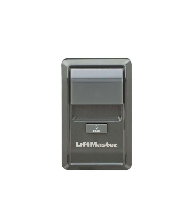 LiftMaster garage door opener wall button in gray.