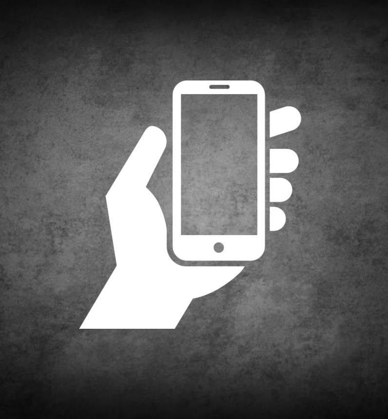 White hand holding a white smartphone against a dark, textured background.