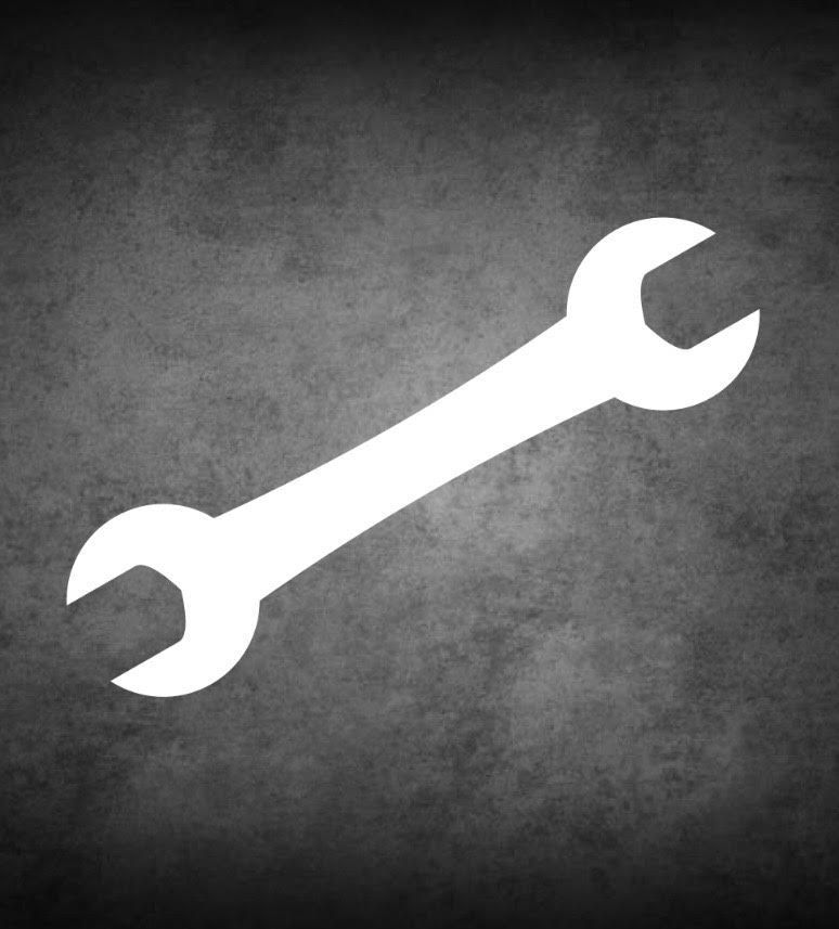 White wrench on a dark, textured background.