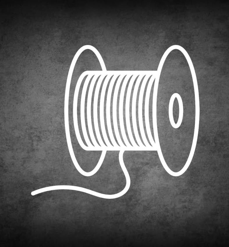 Spool of thread with the thread extending outward.