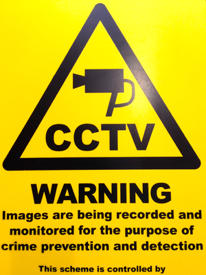 a yellow sign that says warning cctv cameras are being recorded and monitored for the purpose of crime prevention and detection