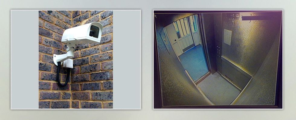 a security camera on a brick wall next to a picture of an elevator