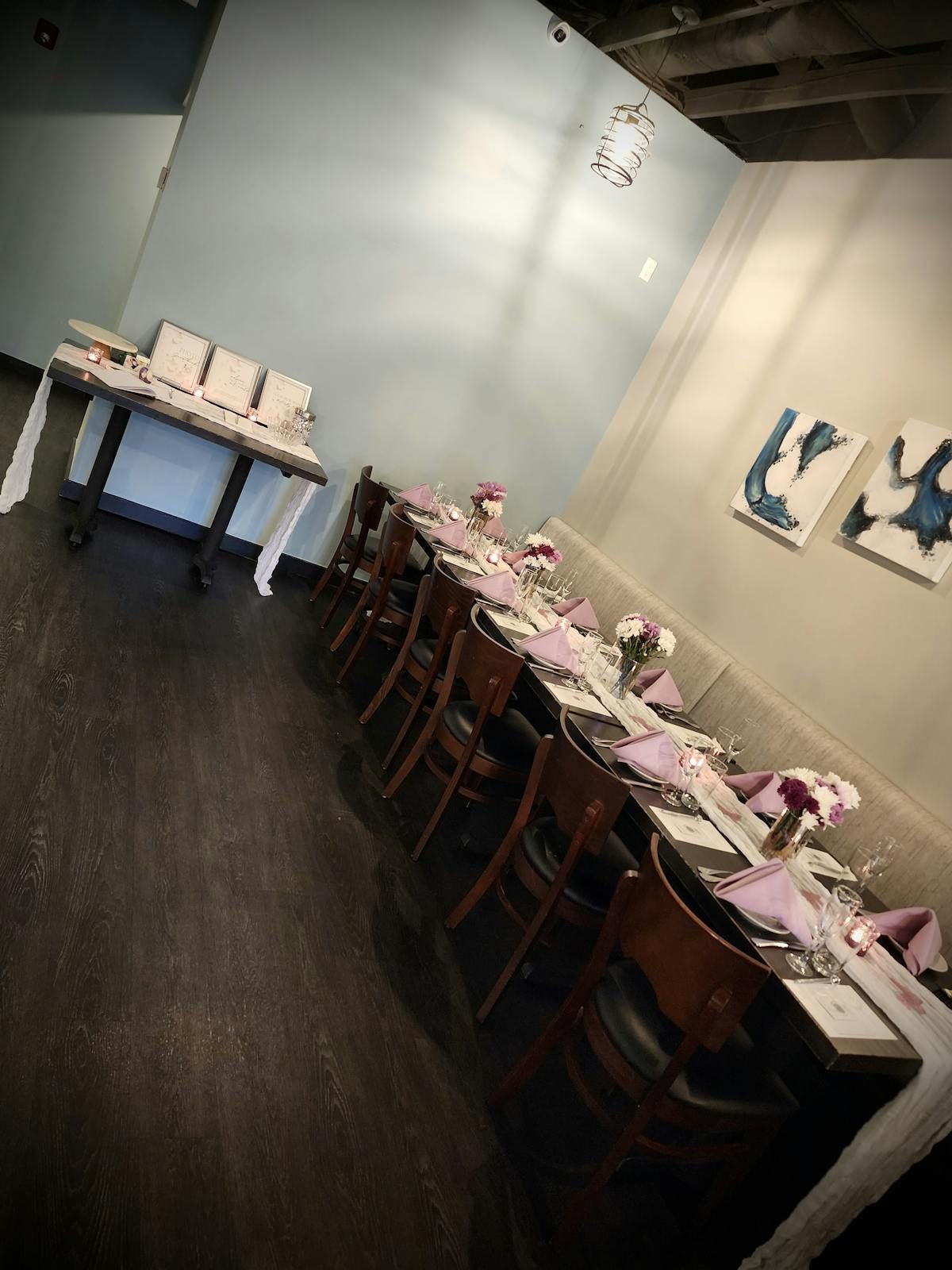 A restaurant with tables and chairs set up for a party